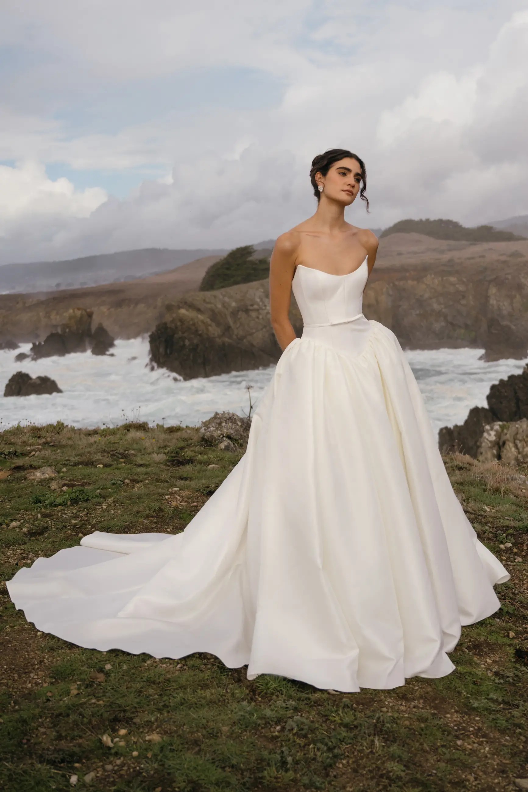 Model is wearing Danielle, a lightweight ball gown wedding dress with a strapless neckline and structured bodice by jenny yoo and hope lavine