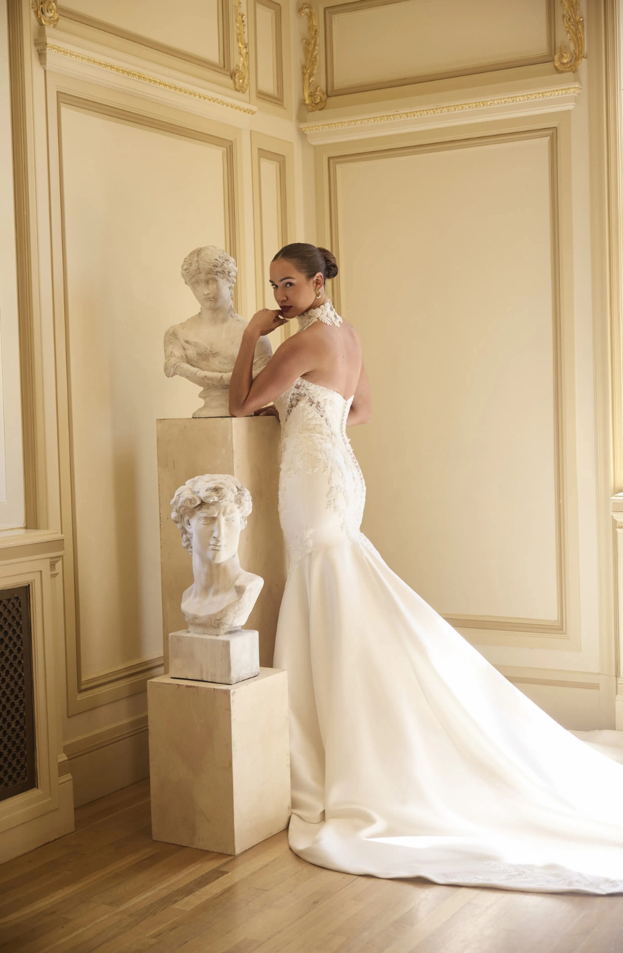 model is wearing a strapless fit and flare wedding dress