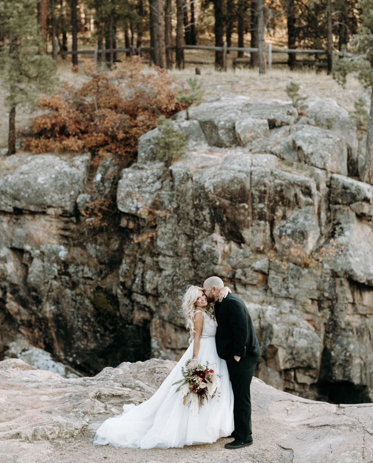Сouple wearing a white gown and a black suit