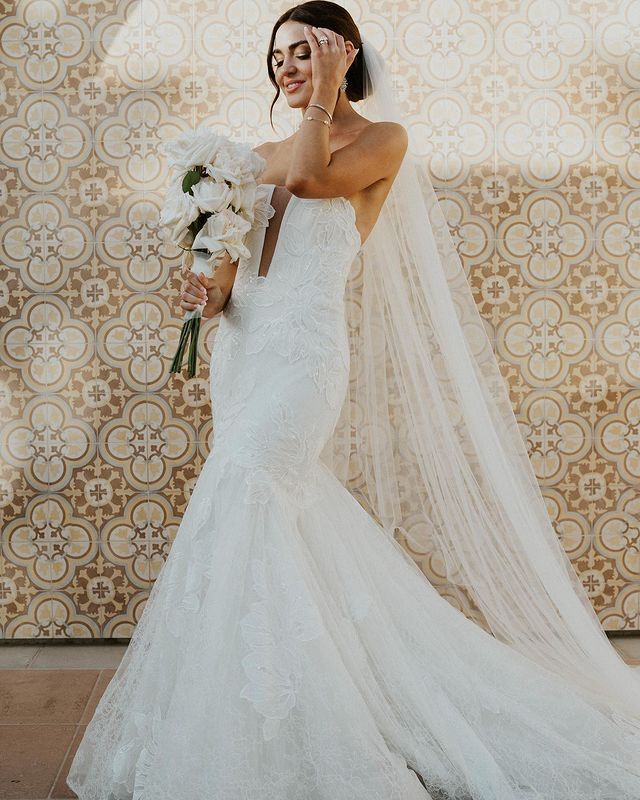 Model wearing a white gown