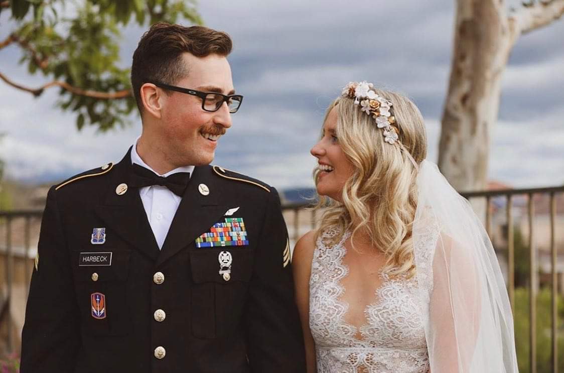 Сouple wearing a white dress and a black suit